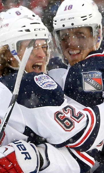 Rangers score 6 straight, top NJ in cold and snow